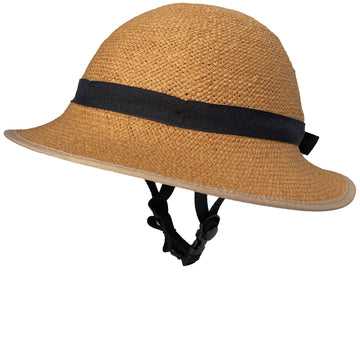 Side-profile view of a straw-hat-style bicycle helmet with a black ribbon band, beige brim, and the base helmet's black chin strap, shown against a white background.